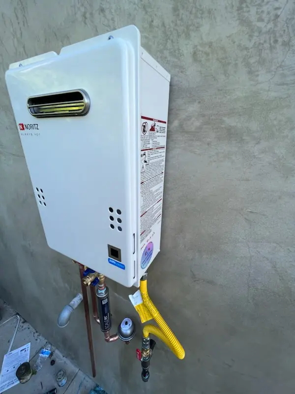 Tankless water heater installation for Denny Whitford homes